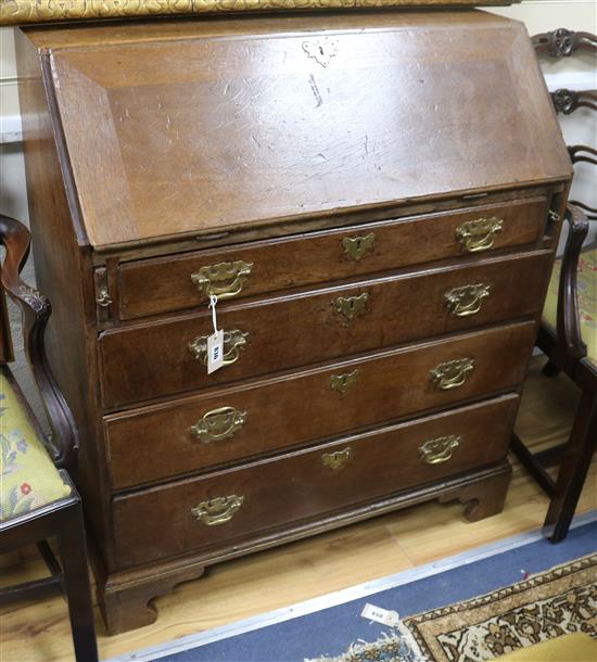 A George III oak bureau W.94cm